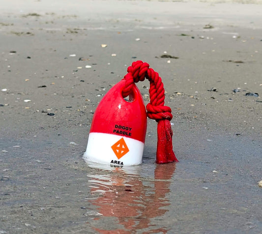 Close-up of The Chewy Buoy water fetch toy on grass