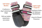 Bark Brite dog booties on paws in outdoor setting
