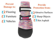 Black Bark Brite booties on paws, outdoor setting
